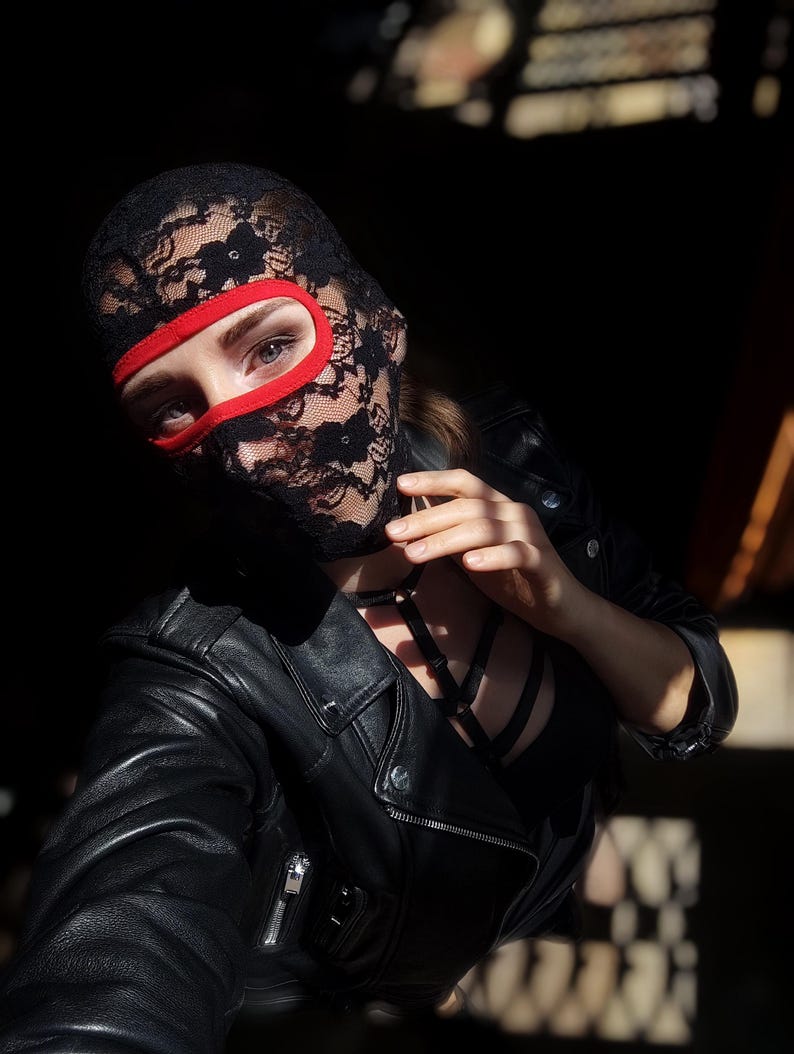 Handmade black and red lace mask, only revealing the eyes.78