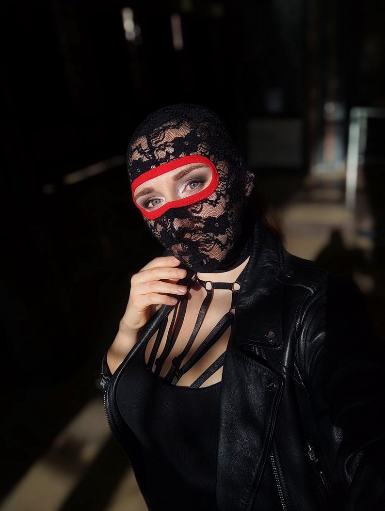 Handmade black and red lace mask, only revealing the eyes.78