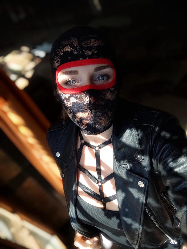 Handmade black and red lace mask, only revealing the eyes.78
